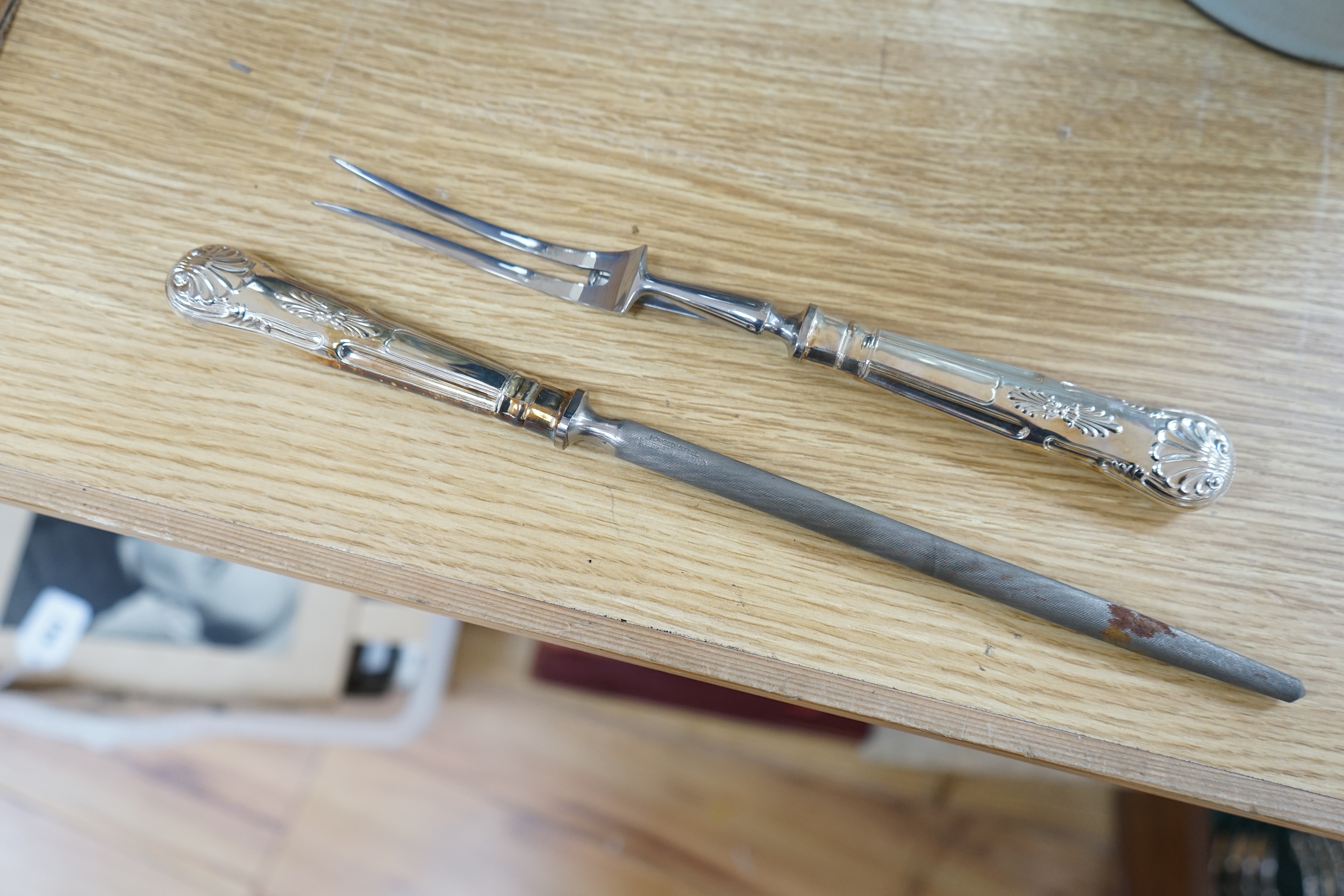 A walnut cased canteen of cutlery with drawer, retailed by Harrods. Condition - one dessert spoon missing